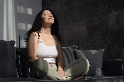 full-shot-woman-meditating-home Large